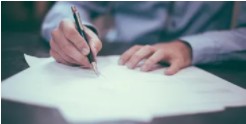 Consultant writing notes on paper
